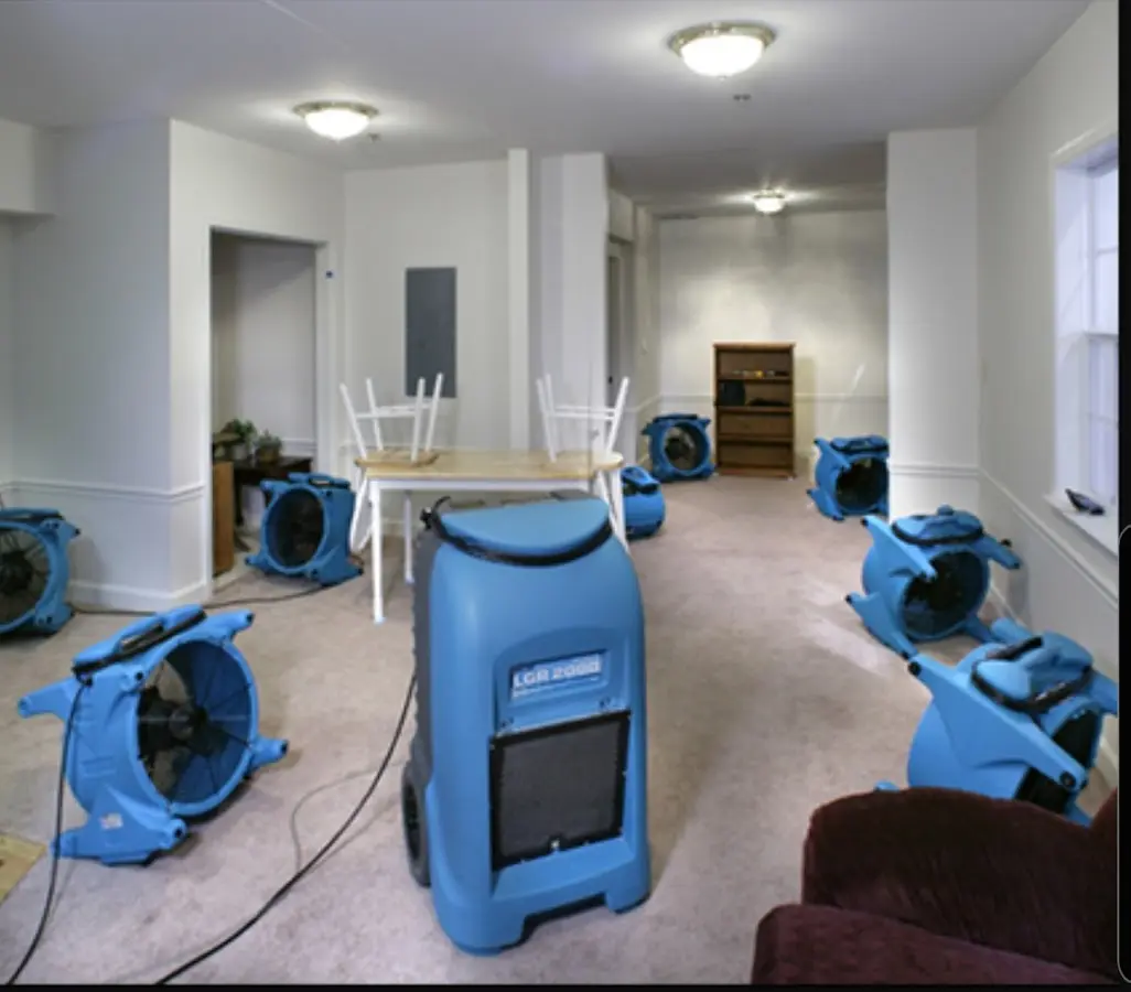 Air movers and dehumidifier setup for Water Damage Restoration in Portage